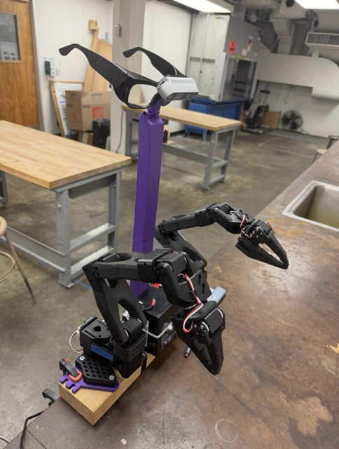 Lab bench setup with SO-ARM101 robot and RealSense camera